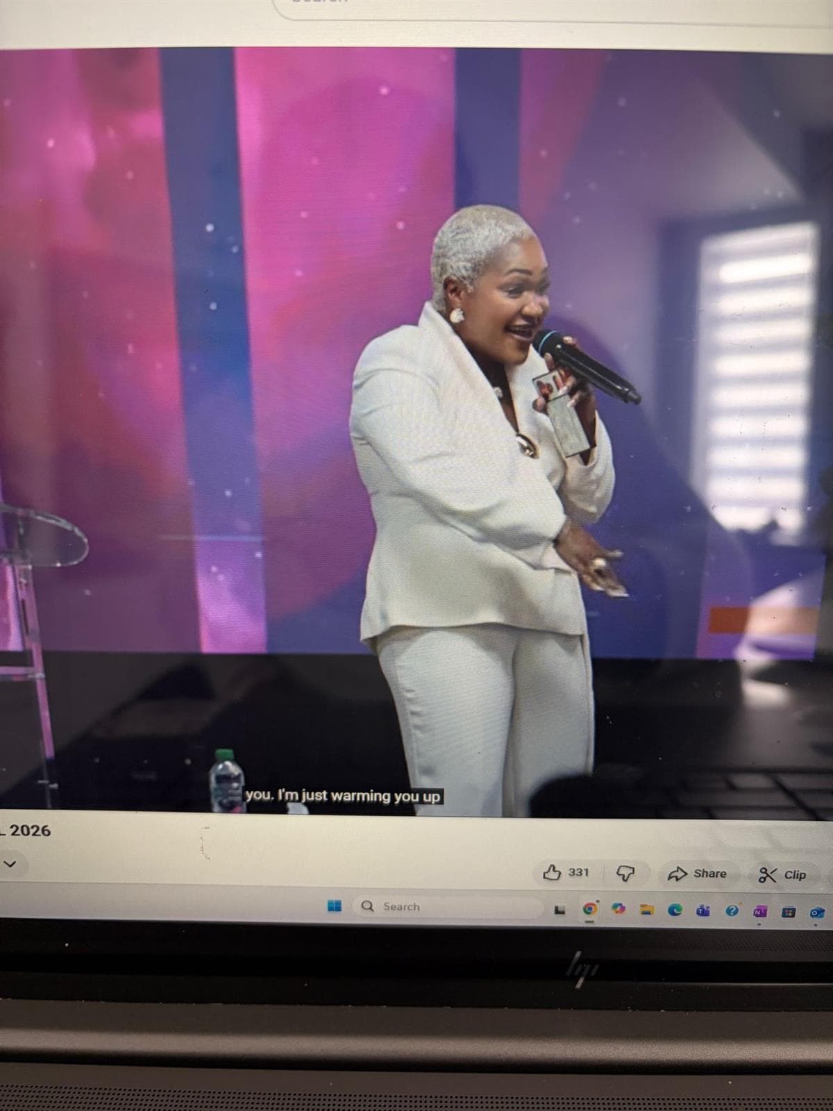 Leader speaking on stage at Heal Africa event
